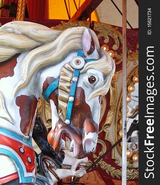 White and brown carousel horse