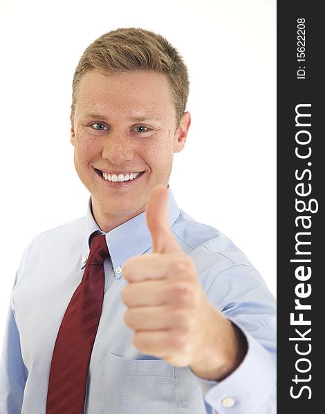 Young businessman giving thumbs up
