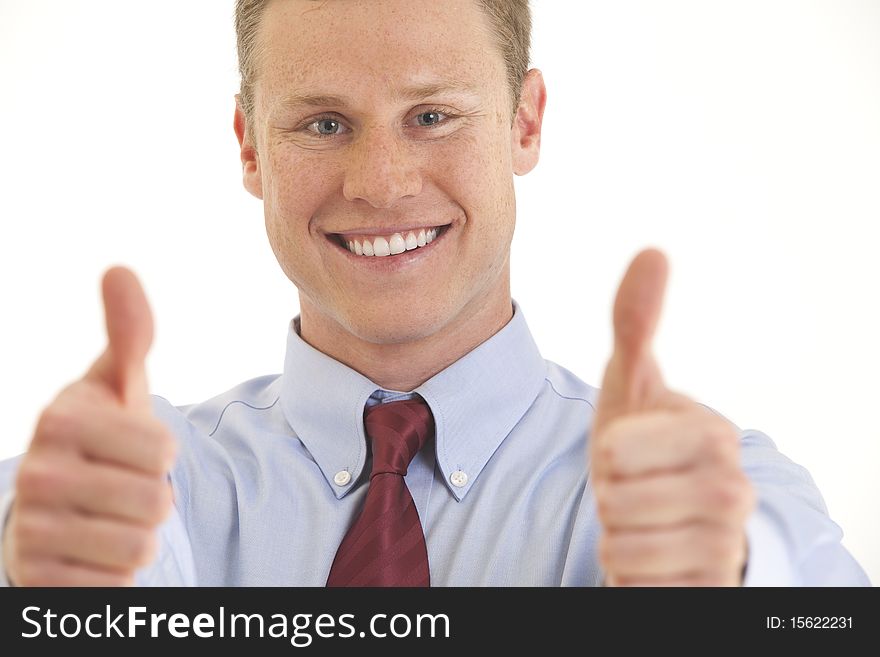 Portrait of smiling young businessman with two thumbs up