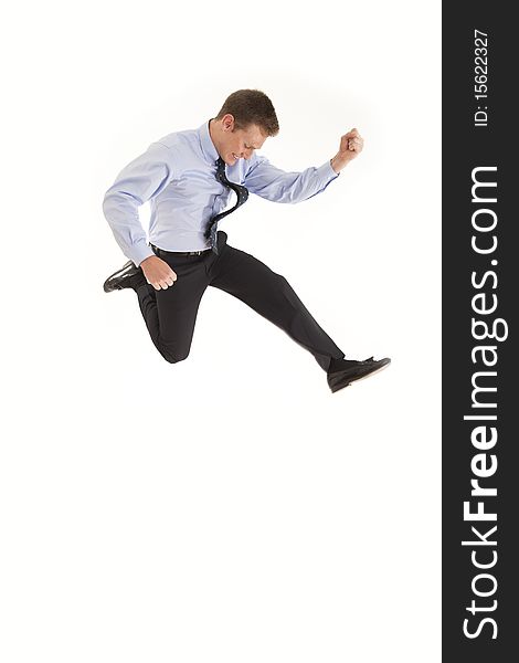 Smiling young businessman jumping in air with happiness. Smiling young businessman jumping in air with happiness