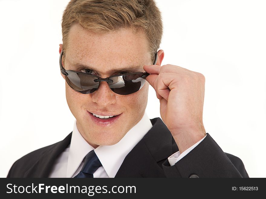Portrait of confident young businessman wearing a suit and sunglasses. Portrait of confident young businessman wearing a suit and sunglasses
