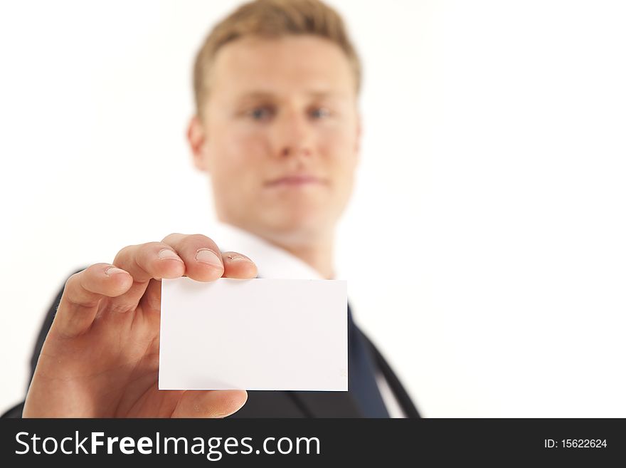 Head and shoulder portrait of businessman holding blank business card