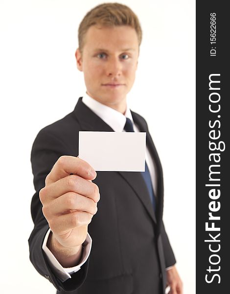 Portrait of businessman showing blank business card to camera