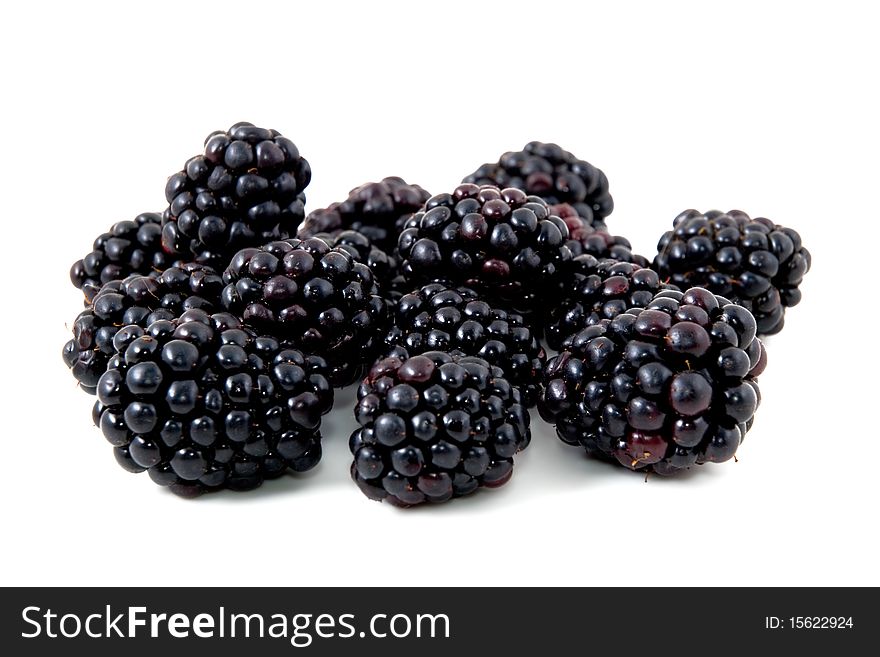 Berries of a blackberry are photographed on a white background. Berries of a blackberry are photographed on a white background