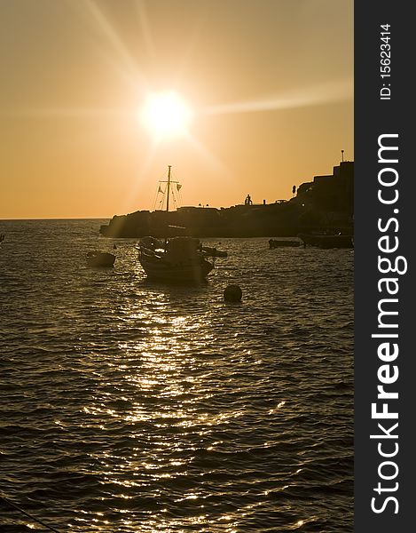 Beautiful boat sailing in the mediterranean sea at sunset. Beautiful boat sailing in the mediterranean sea at sunset