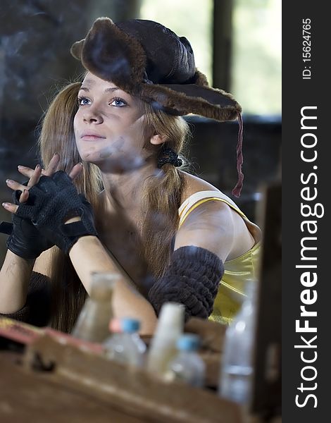 Photo of a chemist woman in a dark laboratory.