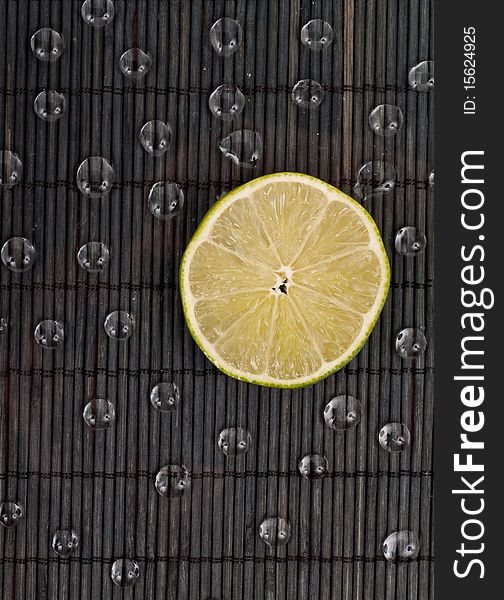 Slice of Lime with Water Drops. Slice of Lime with Water Drops