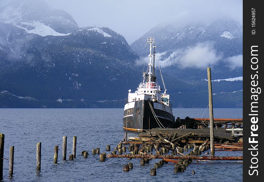 A view of tug boat among mountains, Britannia Beach, Squamish, British Columbia, Canada. A view of tug boat among mountains, Britannia Beach, Squamish, British Columbia, Canada