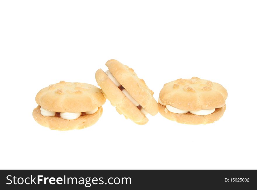 Three whipped cream biscuits isolated on white