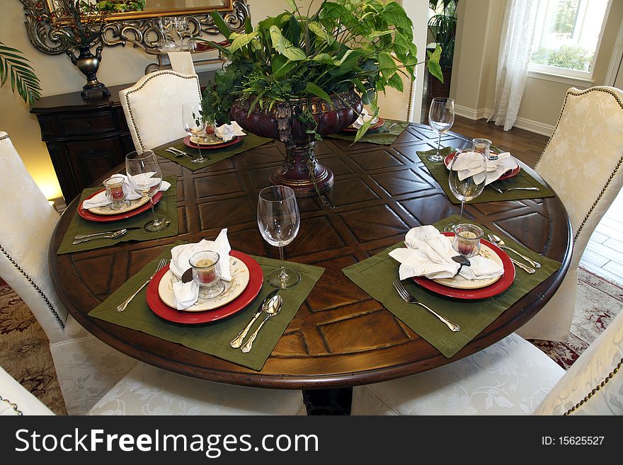 Luxury home dining table with modern tableware. Luxury home dining table with modern tableware.