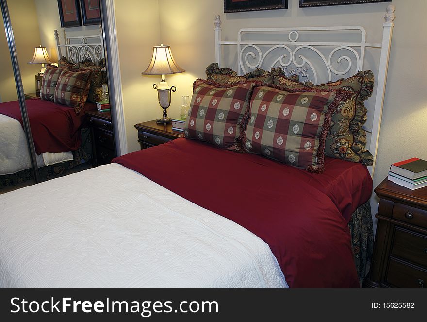 Comfortable modern bedroom with a spacious bed. Comfortable modern bedroom with a spacious bed.