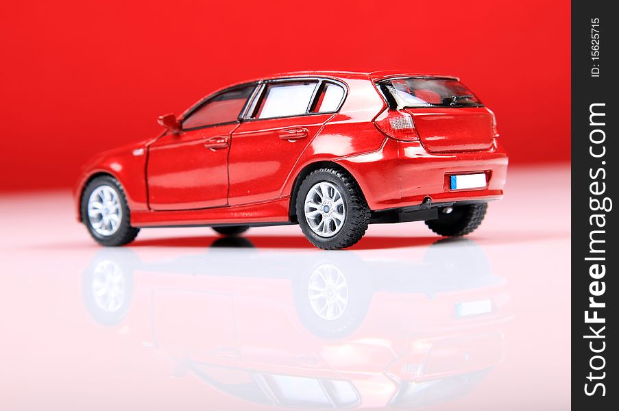 Hatchback car shot in studio with red background. Hatchback car shot in studio with red background.