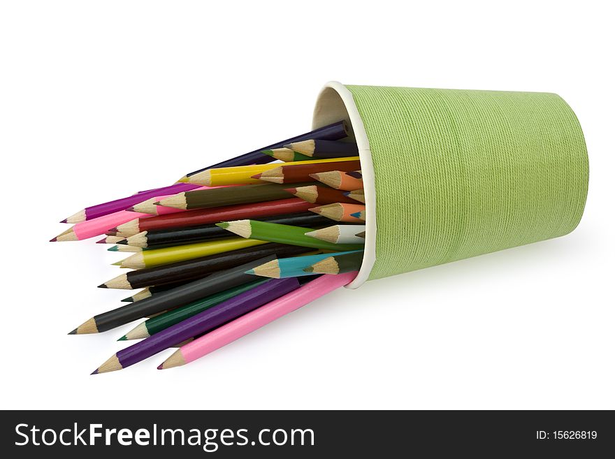 Isolated color pencils are in the glass on a white backround