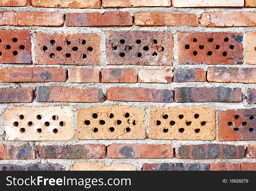 Weathered stained old red brick wall background