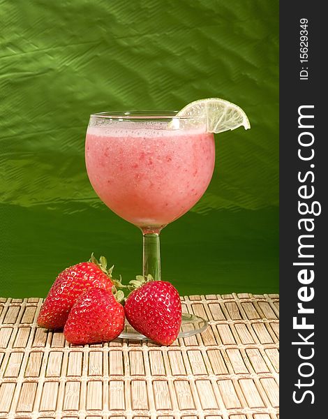 A refreshing smoothie with strawberries and a lime garnish. A refreshing smoothie with strawberries and a lime garnish.