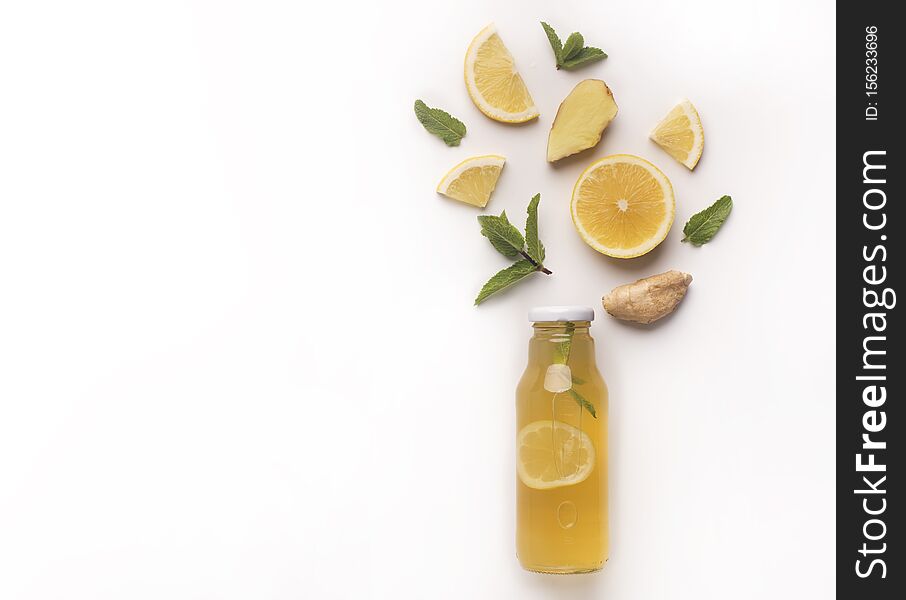 Summer detox lemonade with composition of components on white background with copy space