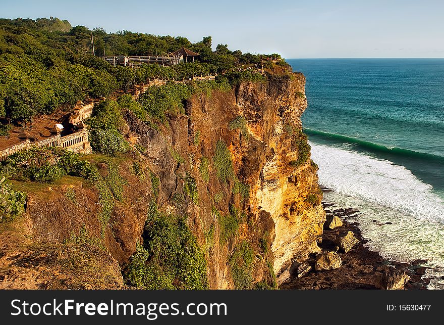 The cliff over the indian ocean near Uluwatu temple, Bali, Indonesia. The cliff over the indian ocean near Uluwatu temple, Bali, Indonesia