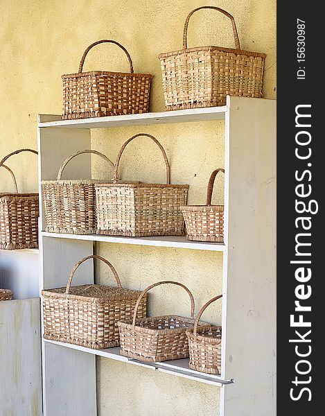 Shelves filled up with basket that is for sale. Shelves filled up with basket that is for sale
