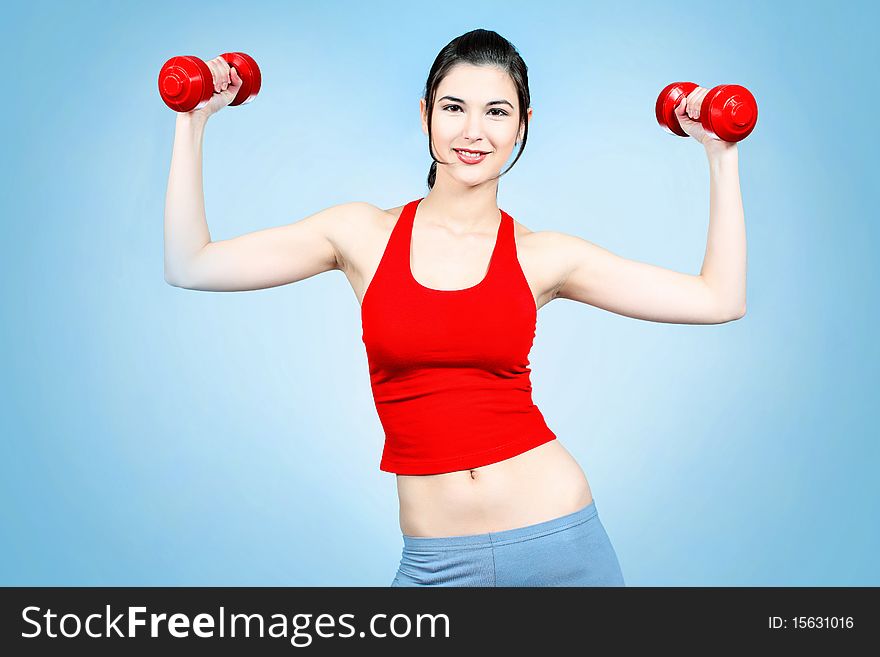 Girl with dumbbells