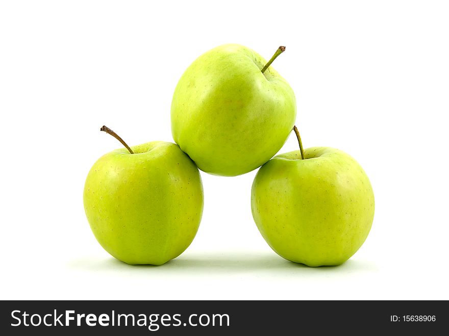 Studio shot of three green apples on white background