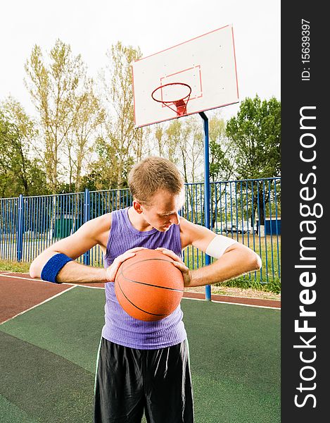 Young men playing street basketball. Young men playing street basketball