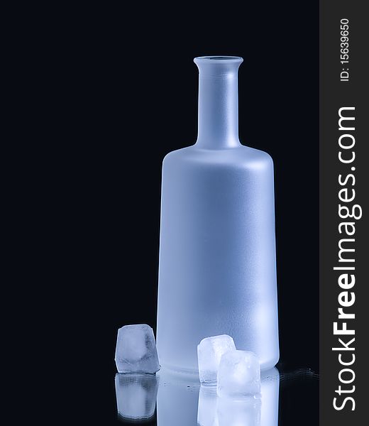 The photo shows a milky bottle and some icecubes