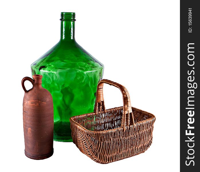 Large bottle, jug and basket on white background. Large bottle, jug and basket on white background