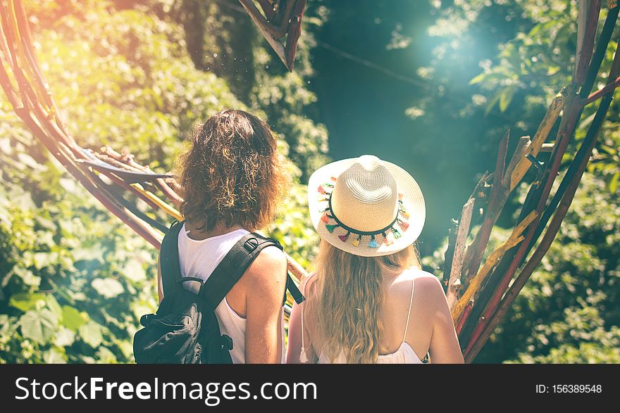 Couple of tourist in the jungle of Bali island