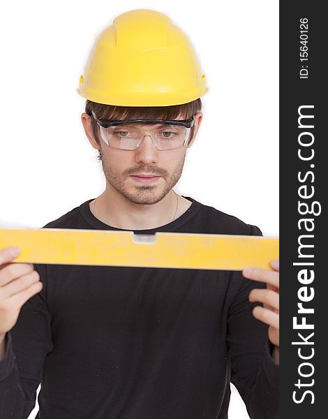 Manual worker with level on white background