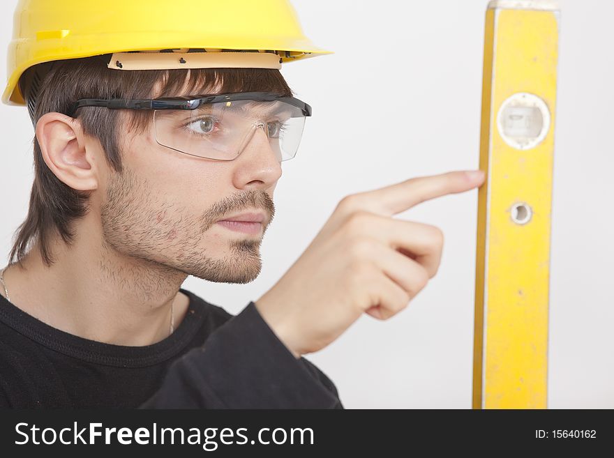 Construction worker with level