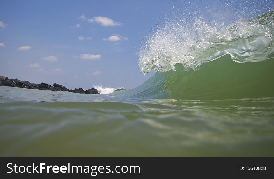 Wave crashing along beach in Atlantic
