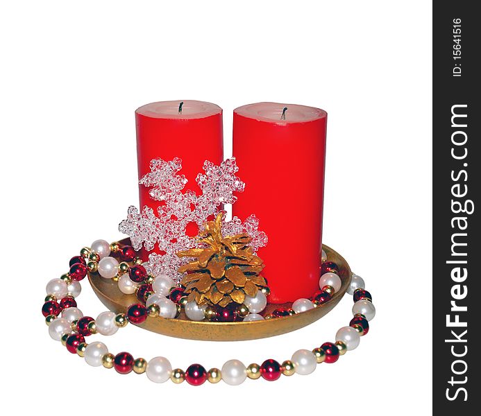 Christmas composition - two big red candles, glass snowflake, beads and gilded pinecone. Christmas composition - two big red candles, glass snowflake, beads and gilded pinecone