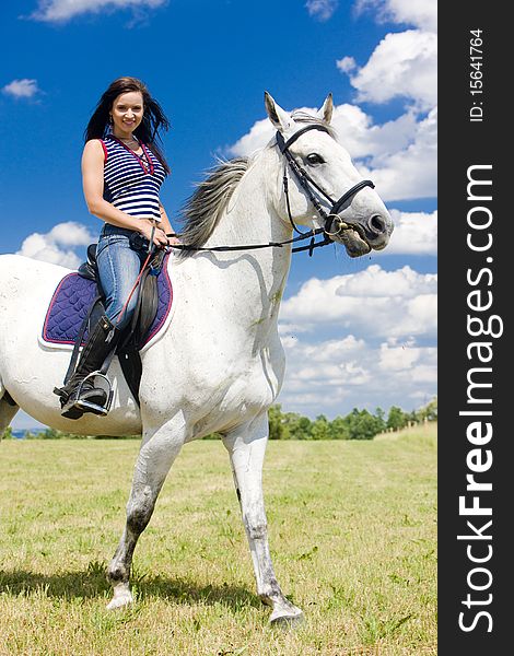 Young woman equestrian on horseback