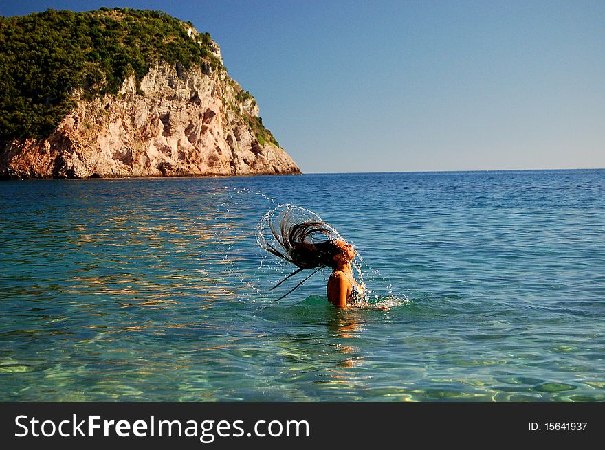 A girl having fun in Adriatic waters of Montenegro