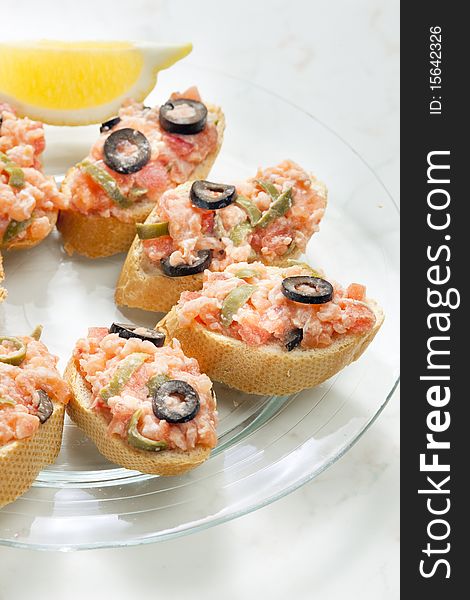 Salmon tartare with capers and black olives