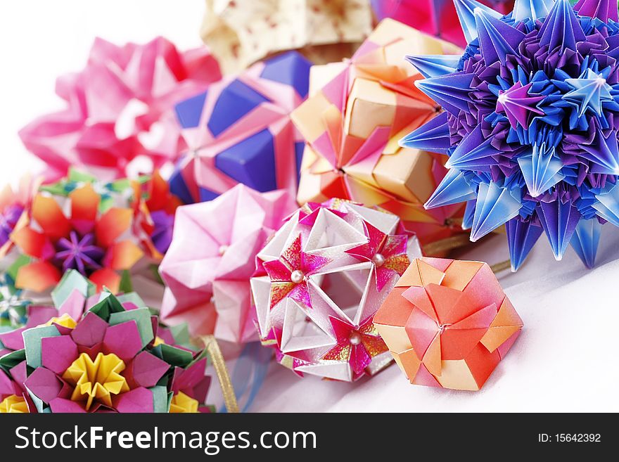 Origami kusudama paper-made balls in composition isolated on white background