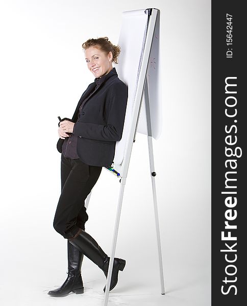 Businesswoman leaning on the whiteboard