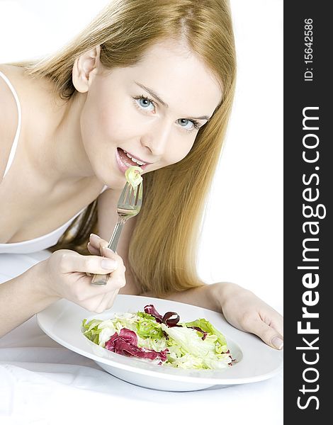 Woman eating salad