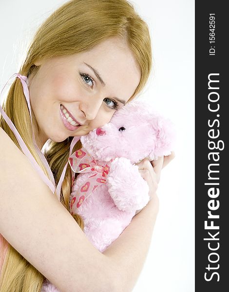 Portrait of smiling young woman with teddy bear