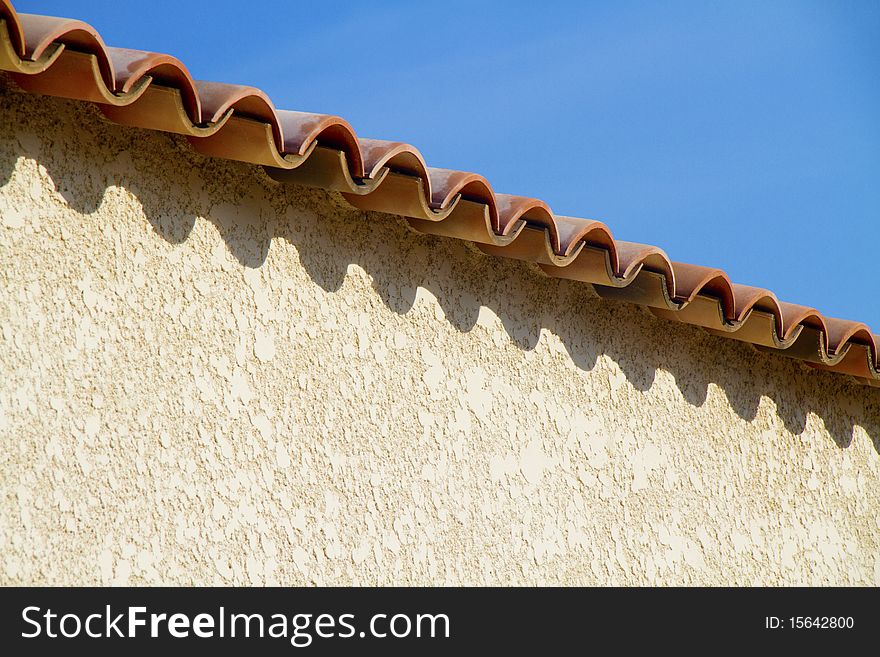 Roof with red tiles and blue skies