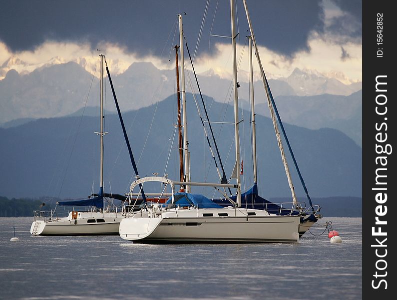 Some sail boats just before a heavy thunderstorm on Lake Starnberg (Germany), one of the Bavarian Lakes. The Alps are in the back.