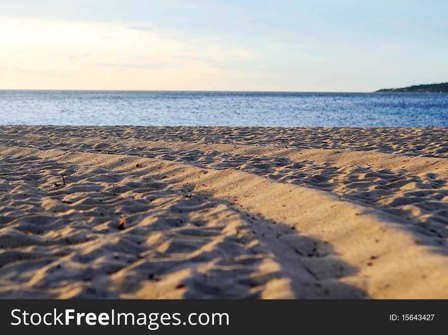 Background with sand, sea and blue sky. Background with sand, sea and blue sky