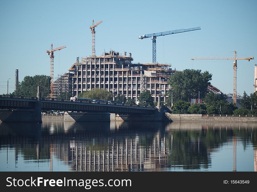 Jib crane construct building near the river
