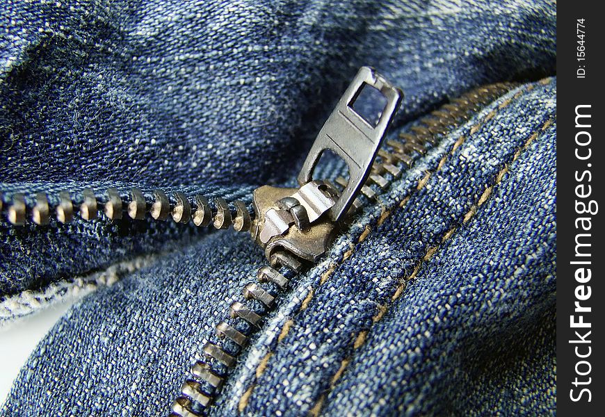 Close on zipper opening jeans pants