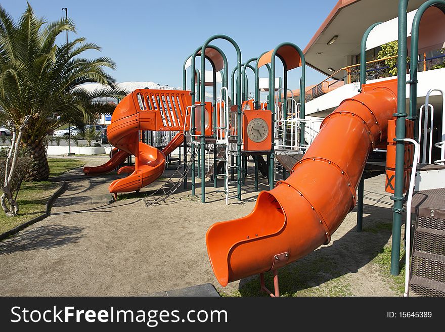 Public park with infantile games in commercial center. Public park with infantile games in commercial center