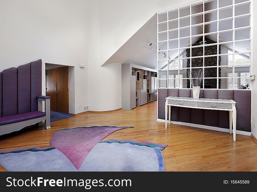 Foyer in contemporary home with entry into family room