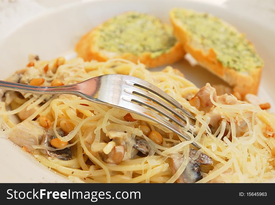 Spaghetti with mushroom sauce and cedar nuts