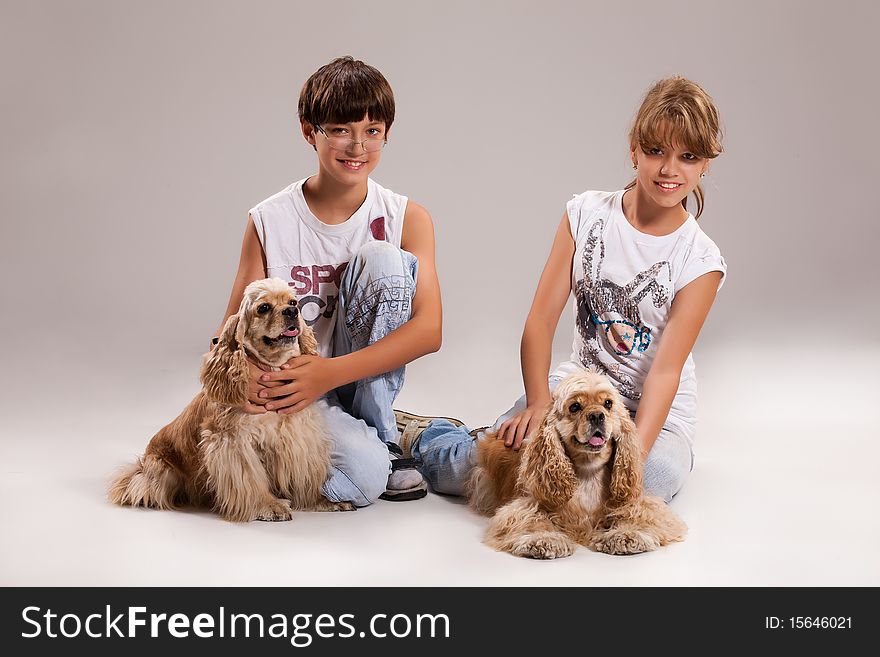 Boy and girl with dogs on isolated background. Boy and girl with dogs on isolated background