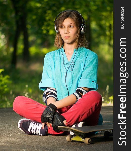 Teenage Girl With Skateboard