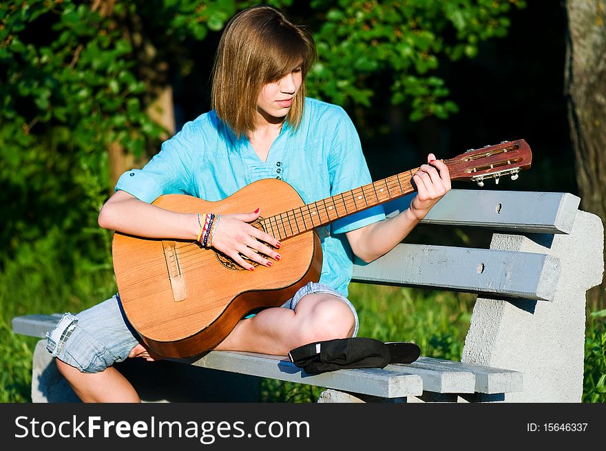 Teenage girl with guitar